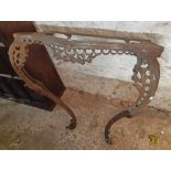 A mid 19th Century fine cast iron console table base of serpentine design with fruit swags and