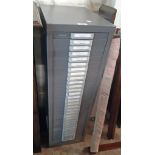 A 11 1/2" vintage grey painted metal collector's file chest with flight of thirty shallow drawers
