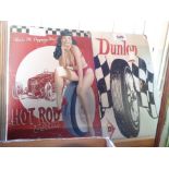 Two reproduction signs for Dunlop tyres and Betty Page