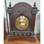 A 19th Century American stained wood cased shelf clock with spring driven gong striking movement -