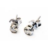 A pair of marked 750 white metal collar set diamond solitaire stud ear-rings - 0.45ct. TDW