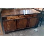 A 4' 4 1/2" antique oak three panel coffer with decorative floral scroll marquetry frieze, blind