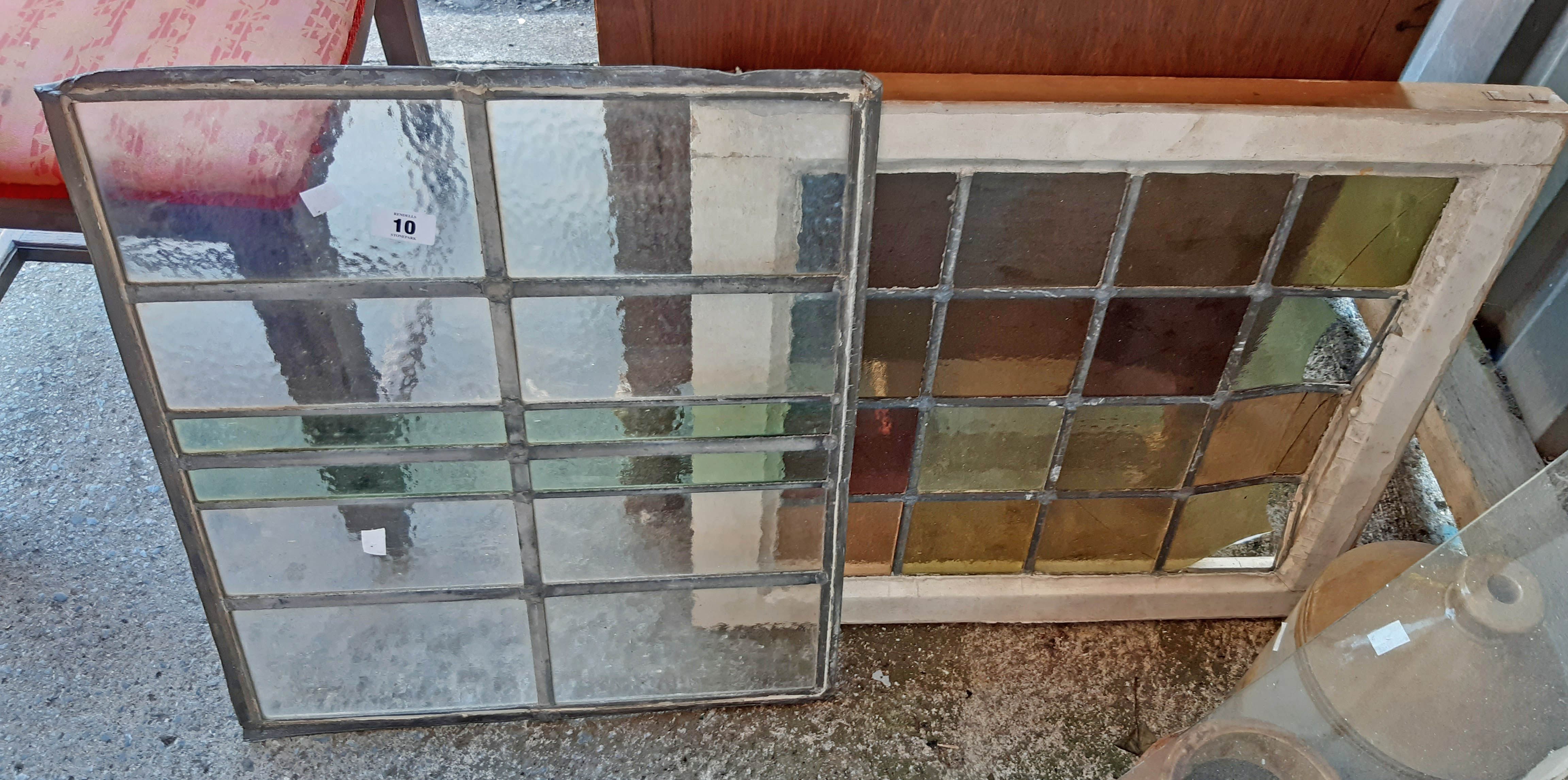 A stained glass panel and a lead lined panel - some damage