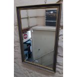 A modern antiqued gilt framed oblong wall mirror