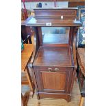 A 15" Edwardian walnut and strung coal perdonium with shelf top, mirror set back and fall-front