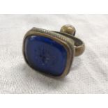 A Victorian fob seal with blue tourmaline depicting bee and motto 'Let Your Words (bee) Mild'