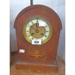 An Edwardian inlaid oak dome topped cased mantel clock with vase motif to front with Samuel Marti