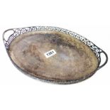 A 12 1/4" silver elliptical tea tray ornate with pierced scroll gallery and flanking handles -