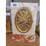 An Art Deco white and red marble cased mantel clock with oval dial marked Le Moan, Douarnenez with