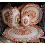 A quantity of Mintons orange Denmark pattern dinnerware including graduated meat plates, tureen with