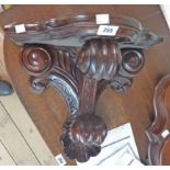 A 17" far eastern hardwood wall bracket in the antique style with scroll supports