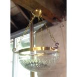 A hanging ceiling light with ornate cut glass pendant, chains and rose