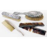 A harlequin silver mounted dressing table brush and comb set, and a crumb brush - various condition