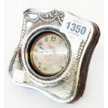 An early 20th Century silver fronted and leather clad Goliath pocket watch stand containing