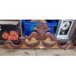 A 3' 5" Victorian carved walnut and mixed wood decorative furniture pediment with acanthus scroll