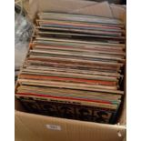 A box containing assorted vinyl LPs including Beatles, Dire Straits, Free, Eagles, Fleetwood Mac,