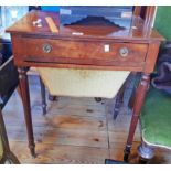 A 23" late Georgian mahogany sewing table with long frieze drawer and slide out tapered work draw,