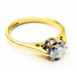 A hallmarked 750 gold diamond solitaire ring - slight damage to girdle
