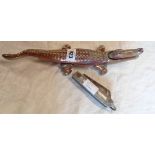 A cast iron and enamel nutcracker modelled as a crocodile - sold with a large British military