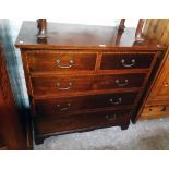 A 3' 6" 19th Century mahogany cross banded and strung chest of two short and three long graduated