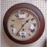An early 20th Century walnut cased dial wall timepiece with Roman numerals and spring driven eight