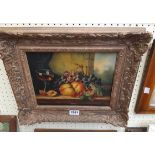 A gilt gesso effect framed reproduction oil on panel still life, with fruits and goblet on a table -