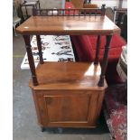 A 23" Victorian mahogany two tier display stand with spindle rail to back, turned supports and
