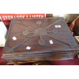 An old mixed wood box with moulded decoration to top