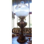 A table oil lamp with chimney and globe - converted to electricity