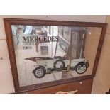 A stained wood framed reproduction Mercedes advertising mirror, depicting the 1908 Edwardian Tourer