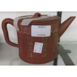 An antique Chinese Yixing zisha terracotta teapot of cylindrical form with infuser and impressed