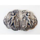 An Anglo Indian white metal nurse's buckle with raised female warrior deity decoration