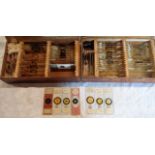 A cigar box containing W. Watson and other glass microscope slides including biological, and another