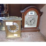 A mahogany cased dome topped mantel timepiece with flanking pillars and back winding movement - sold