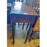 A 19 1/4" 19th Century mahogany drop-leaf side table with drawer to one end, set on turned legs -