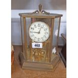 A vintage brass and bevelled glass faceted cased Kundo anniversary table clock with decorative