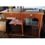 A late 1960`s Singer 457 sewing machine with teak effect stowing table, attachments and