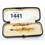 A marked 9ct. and GS (silver gilt) bar brooch set with tourmaline and seed pearls - sold with