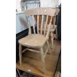 Three matching 20th Century blond wood Windsor style kitchen chairs with solid sectional seats,