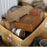 A box containing assorted items including tins, boxes, etc.