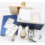 A Tissot PR 100 gentleman's steel cased wristwatch with card sleeve and drawer fitted presentation