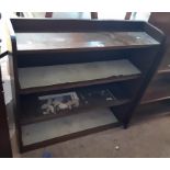 A 20th Century stained oak three shelf bookcase - glass sliding doors missing