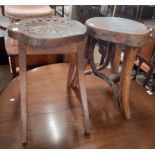 An old rustic three legged stool with thick solid top and natural branch supports - sold with