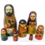 An early 20th Century Matryoshka doll family depicting a father, mother and five children -