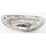 A 11 1/2" silver elliptical dish with decorative pierced border and reeding - retailed by