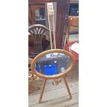 A travelling easel by Daler-Rowney - sold with a small pine framed oval wall mirror