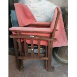 A pair of John Lewis stained beech framed director's style folding chairs with faded salmon pink