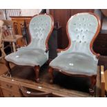 A pair of reproduction Victorian style mahogany part show frame spoon back nursing chairs with green