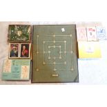 A vintage game board - sold with a set of vintage unopened Guinness playing cards, and further boxed