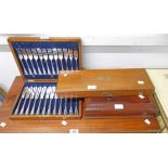 A polished oak cased set of twelve each silver plated fish knives and forks - sold with a flame